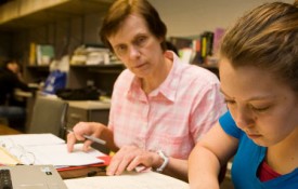 Image: Peggy Cebe, Professor of Physics, receives an award for her teaching. Professor Cebe is a polymer physicist who has become well known for teaching classes to the hearing impaired.